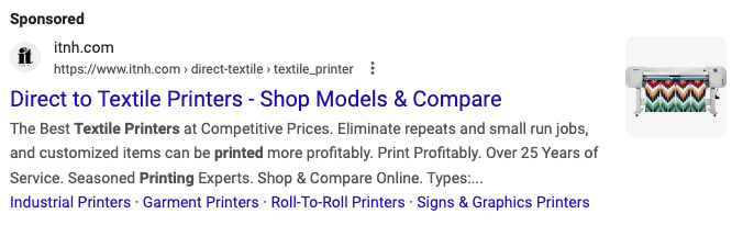 A Google Search Ad with the headline Direct to Textile Printers - Shop Models & Compare. There is a photo of a textile printer with colorful striped fabric.