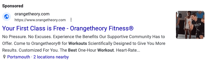 A Google Search Ad with the headline: Your First Class is Free - Orangetheory Fitness. There is a small square photo of a man exercising, with a woman standing in the background.