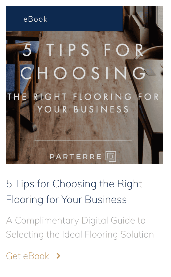 A square image of a floor that looks like hardwood. Over the image is text that reads: “5 Tips for Choosing the Right Flooring for Your Business.” There is a hyperlinked call-to-action to “Get the eBook.”