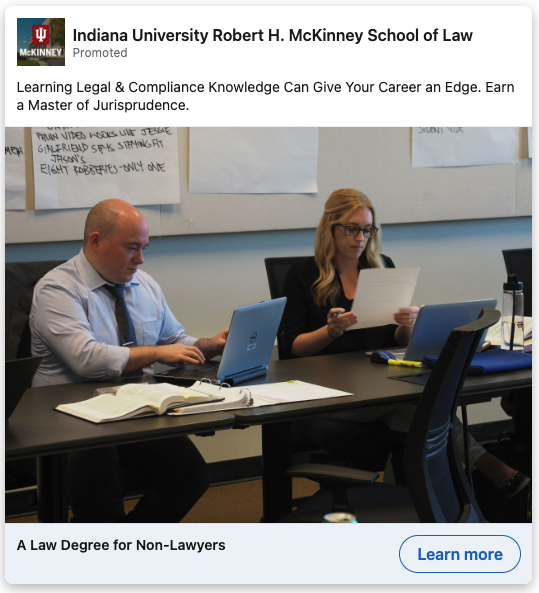 LinkedIn ad for Indiana University Robert H. McKinney School of Law. The ad's featured image shows two students sitting side-by-side at a table with their laptops open in front of them.