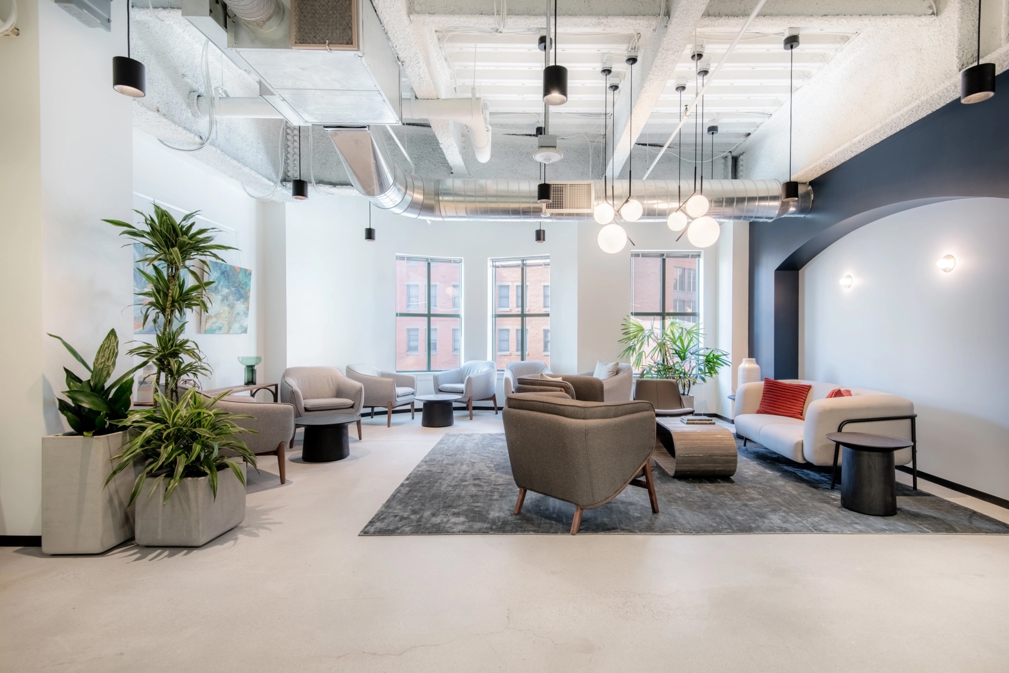 Digital Marketing Agency - Boston, MA 1 A spacious office area featuring comfortable couches and chairs for relaxation and collaboration.