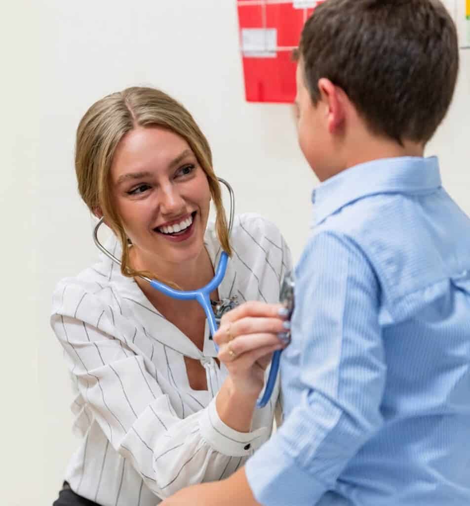 USD Hahn | Vital Design 3 USD Hahn student listening to patients heartbeat